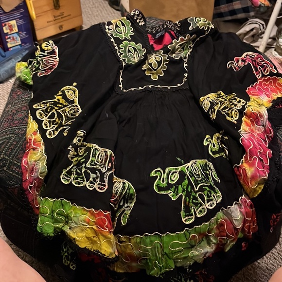 A black top with elephants, and then embroidery around the elephant and neckline - Picture 3 of 5